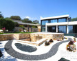 New designer villa with direct sea views over Cala Domingos bay