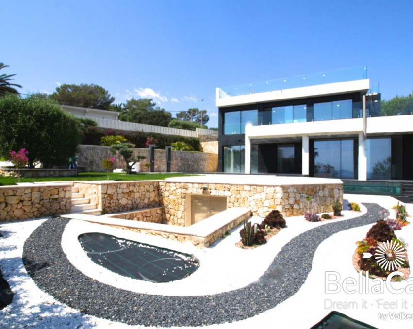 New designer villa with direct sea views over Cala Domingos bay